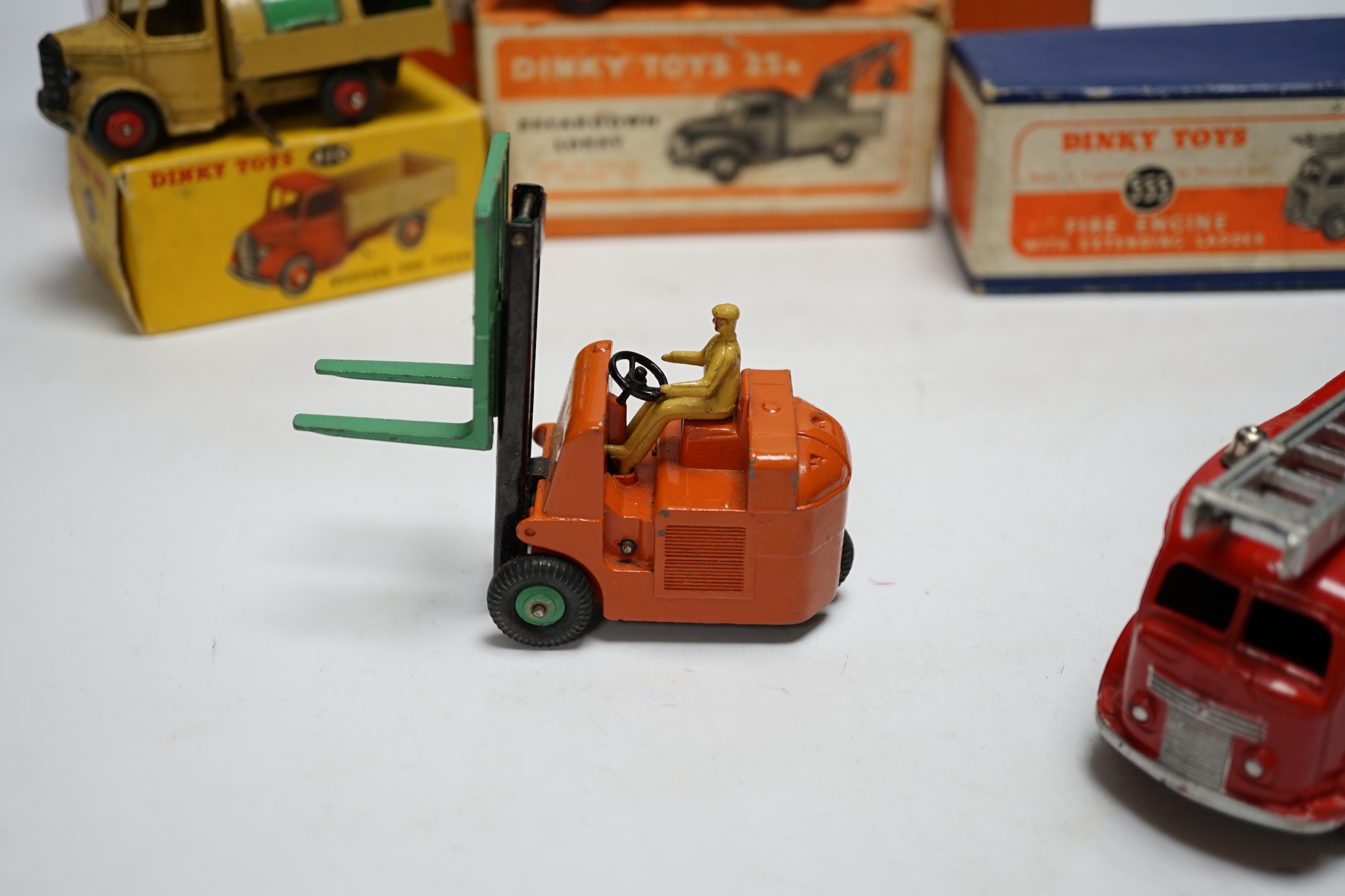 Five boxed dinky toys including (25x) breakdown lorry, (410) Bedford End Tipper, (555) Fire Engine, (571) Coles Mobile Crane, and (14c) Coventry Climax Fork Lift Truck